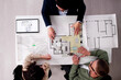 © Andrey Popov - Family Consults With Real Estate Agent