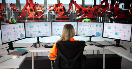 Fototapete - Female Engineer Controlling Robotic Assembly Line