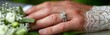 © BrandwayArt - Beautiful wedding rings displayed on lace-clad hand with bouquet