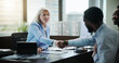 © EinFrame25/peopleimages.com - Business, woman and handshake with couple in meeting for investment planning, debt management or thank you. Financial advisor, mature person and shaking hands in consultation for compliance agreement