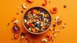 © Juan - Healthy granola bowl on orange background with dried fruits nuts vibrant breakfast snack nutrition