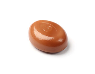 Wall Mural - One tasty sweet caramel candy isolated on white