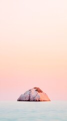 Wall Mural - muted pink sunset over small volcanic island