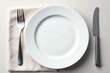© Busban - Elegant empty white plate with polished silver fork and knife , still life, setting