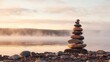 © Dmitry - A stack of rocks on a beach at sunrise.