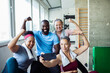 © Marko Geber - Diverse group of happy seniors and fitness trainer taking a post-workout selfie at the gym