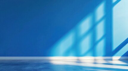 Wall Mural - a blue wall with a window casting shadows on it, with a white floor in the foreground.