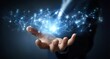 © nikolettamuhari - A businessman's hand holds a virtual, glowing network connection structure with blue light on a