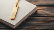© MAY - Gold bookmark with a delicate design, placed in a leather bound journal, ready for use.