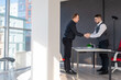 © Михаил Решетников - Two Caucasian men shaking hands. Interview or business meeting.
