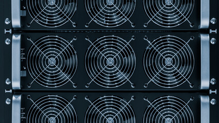 Poster - A black computer tower with a large fan on the top. The fans are black and silver. The tower is made of metal