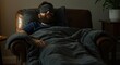 © Matt - Man with beard sleeping on brown leather couch with dark blue blanket and black sleep mask