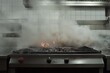 © Selsi - Commercial kitchen grill ablaze with dense smoke