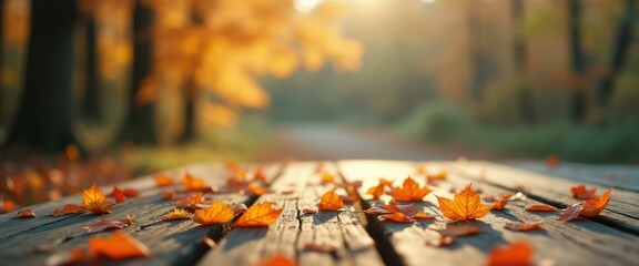 Poster - Autumn leaves lying on wooden surface in serene park setting