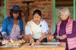 © Martin Stock Studio - Latin american women preparing traditional cuy dish in otavalo, ecuador
