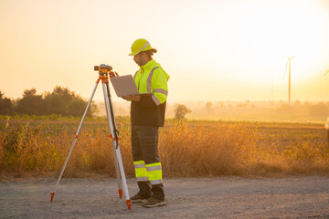 Aufkleber - Engineer man working with tablet at windmill farm Generating electricity clean energy. Wind turbine farm generator by alternative green energy.