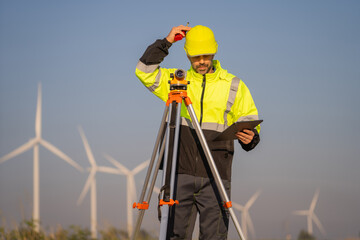 Aufkleber - Engineer man working with tablet at windmill farm Generating electricity clean energy. Wind turbine farm generator by alternative green energy.