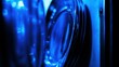 © Smoky - Close-up of blue computer fan with dark background and abstract lighting in a studio setting