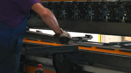 Poster - Skillful operator uses metal bending machine for precise shaping of components