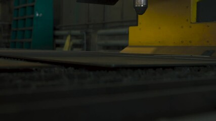 Fototapete - Precision metal part fabrication using laser cutting technology in workshop