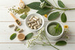 © ImageHome - Natural supplements with pills powder and botanicals representing healthy lifestyle and wellness.