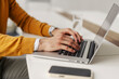 © Dusan Petkovic - Close up of businessman's hands typing on a laptop at corporate office.