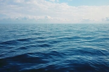 Aufkleber - Tranquil Deep Blue Ocean with Rolling Waves Under a Bright Cloudy Sky on a Sunny Day Showing Vast Open Water and Rhythmic Textures Evoking Serenity and Oceanic Grandeur