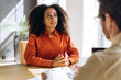 © Maria Vitkovska - Young professional Latin woman having job interview with hr manager