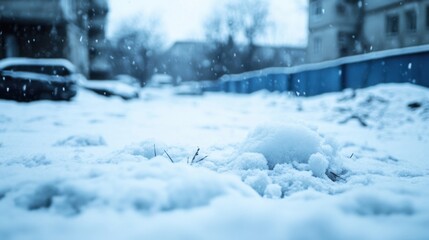 Poster - A small plant struggles to peek through a thick blanket of snow during a gentle snowfall, with blurred city buildings and parked cars in the background. : Generative AI