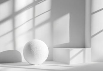 Leinwandbilder - A textured white sphere rests beside a minimalist white cube, bathed in the soft light and shadows cast by a window. : Generative AI