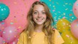 © Alicia - Smiling young woman with balloons and confetti against a colorful background.