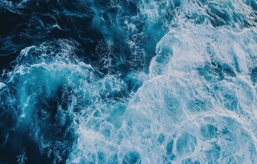 Poster - Aerial view of ocean waves, showing a dynamic interplay of deep blue water and white foam, creating a textured and powerful seascape. : Generative AI