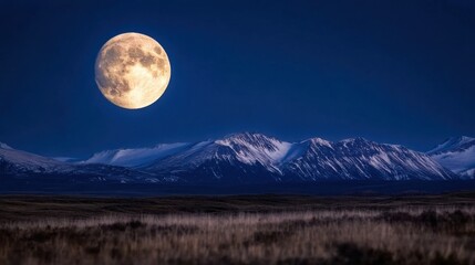Aufkleber - Large, full moon illuminating snow-capped mountains and a vast, dark plain under a deep blue night sky. : Generative AI