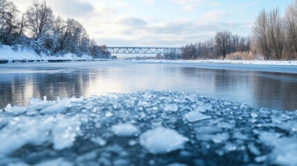 Poster - Frozen river scene with a steel bridge in the background, showcasing a winter landscape with snow-covered banks and ice crystals in the foreground. : Generative AI