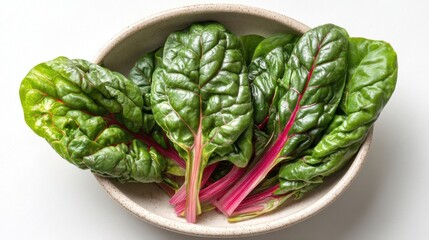 Aufkleber - A bowl of vibrant, fresh Swiss chard leaves, showcasing their deep green color and striking crimson stems.  The leaves are arranged naturally, highlighting their texture and healthy ap : Generative AI
