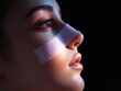 © megis - Woman showing nose after rhinoplasty surgery with band aid