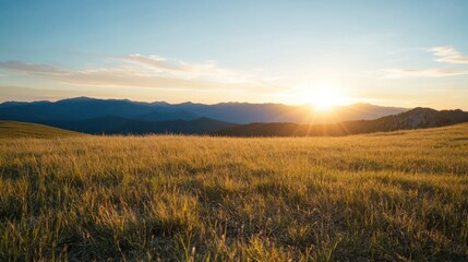 Poster - Golden hour sunset over a vast mountain meadow, showcasing tall grass illuminated by the warm light, with a dramatic mountain range in the background. : Generative AI