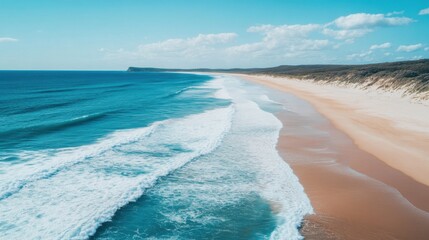 Poster - Aerial view of a pristine beach with turquoise ocean waves gently rolling onto the shore, a tranquil coastal landscape under a sunny sky. : Generative AI