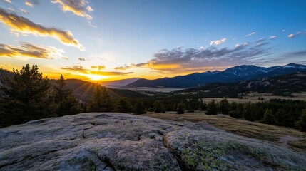 Fototapete - Majestic sunset over rocky mountain landscape, showcasing vibrant orange and purple hues in the sky, with a foreground of textured granite rock and a vast pine forest stretching toward : Generative AI