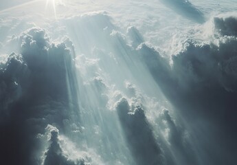 Aufkleber - A breathtaking aerial view reveals sunbeams piercing through a dramatic expanse of cumulus clouds, creating a celestial, ethereal scene. : Generative AI