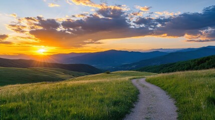 Fototapete - Sunset over rolling hills and a gravel path, showcasing vibrant orange and purple hues in the sky, with distant mountains silhouetted against the golden light. : Generative AI