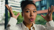 © Yuliia - Shocked African American woman female girl businesswoman brainstorm headshot outdoors face brain head boom gesture problem overwhelmed mind expression emotions business city explosion bomb ethnic town