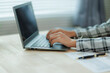 © Wanchai - Professional female accountant reviewing annual expense reports at her desk with a laptop and paperwork — ideal for finance, tax, and corporate business themes.