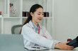 © Wanchai - Female healthcare worker checking an elderly patient’s vital signs indoors, showing compassionate support and the importance of senior health and wellness.