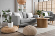 © Pixel-Shot - Interior of light living room with sofa, coffee table and armchair