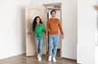 © Prostock-studio - Smiling couple opening door and walking in their apartment, entering new home, happy cheerful young guy and lady standing in doorway of modern flat, looking at design interior together, coming inside