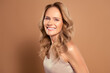 © Beauty Hero - Portrait of a mature woman with blonde hair and a confident expression, showcasing elegant style and graceful beauty