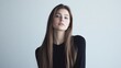 © bo - Portrait of a beautiful young woman with long hair posing in studio