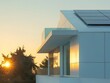 © ir - Architectural view showcasing the sleek white facade of a modern home at sunset.