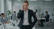 © SRD - Overwhelmed Businesswoman Experiencing Stress and Headache in Busy Office Environment